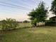 Well-manicured backyard with lush greenery and privacy fencing at 3804 Janie Ct, Orlando, FL 32822