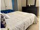 Bedroom with comfortable beds, dresser, and tile floors, filled with natural light at 3804 Janie Ct, Orlando, FL 32822