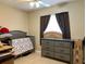 Cozy bedroom with furniture at 3804 Janie Ct, Orlando, FL 32822