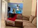 View of comfortable living room with stylish decor, open layout, and tile flooring at 3804 Janie Ct, Orlando, FL 32822