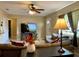 Comfortable living room featuring neutral walls, ceiling fan, and tile flooring at 3804 Janie Ct, Orlando, FL 32822