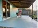 Covered patio with cozy seating, perfect for relaxing outdoors at 3804 Janie Ct, Orlando, FL 32822