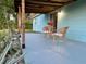 Covered patio with wicker seating and plants, ideal for outdoor enjoyment at 3804 Janie Ct, Orlando, FL 32822