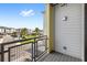 Balcony showcasing views of community landscaping, palm trees, and multi-story residential buildings at 7573 Laureate Blvd # 1301, Orlando, FL 32827
