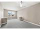 Second floor open loft with carpet and a bright window view at 7573 Laureate Blvd # 1301, Orlando, FL 32827