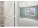 Bedroom featuring two bright windows and is freshly painted with a view to a walk in closet at 7573 Laureate Blvd # 1301, Orlando, FL 32827