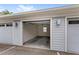 Garage with open door. Two other garages are present in the image at 7573 Laureate Blvd # 1301, Orlando, FL 32827