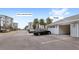 View of the garage with car parked in front, situated near apartment building at 7573 Laureate Blvd # 1301, Orlando, FL 32827