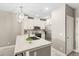 Modern kitchen featuring stainless appliances, white cabinets, and a breakfast bar at 7573 Laureate Blvd # 1301, Orlando, FL 32827