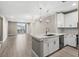 Open-concept kitchen, dining, and living room area with bright, natural light at 7573 Laureate Blvd # 1301, Orlando, FL 32827