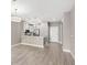 Bright, open kitchen boasts stainless steel appliances, pendant lighting, and a breakfast bar, perfect for modern living at 7573 Laureate Blvd # 1301, Orlando, FL 32827