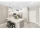 Modern kitchen features stainless appliances, bar stool seating, and a sleek design at 7573 Laureate Blvd # 1301, Orlando, FL 32827