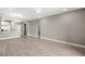 Bright, open living space featuring wood look tile floors and recessed lighting at 7573 Laureate Blvd # 1301, Orlando, FL 32827