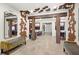 Spacious lobby area enhanced by wooden beams and decorative wall and ceiling panels at 7573 Laureate Blvd # 1301, Orlando, FL 32827