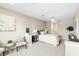 Spacious main bedroom with a ceiling fan, ensuite bathroom, and neutral color scheme at 7573 Laureate Blvd # 1301, Orlando, FL 32827