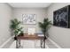 Well-lit home office with stylish desk, artwork, and decor at 7573 Laureate Blvd # 1301, Orlando, FL 32827
