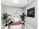 Cozy home office featuring stylish decor, ample natural light, and wood look tile flooring at 7573 Laureate Blvd # 1301, Orlando, FL 32827