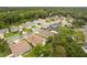 A neighborhood aerial view with tree coverage and manicured lawns at 1611 Sand Key Cir, Oviedo, FL 32765