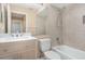 Neutral bathroom featuring a tiled shower and bath, updated vanity, and a large mirror at 1611 Sand Key Cir, Oviedo, FL 32765