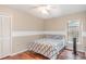 Bedroom with natural light, wood floors, ceiling fan and a closet at 1611 Sand Key Cir, Oviedo, FL 32765