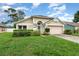 Charming single-story home featuring a well-maintained lawn and inviting curb appeal at 1611 Sand Key Cir, Oviedo, FL 32765
