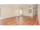 Spacious living room filled with natural light, complemented by wood flooring at 1611 Sand Key Cir, Oviedo, FL 32765