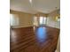Bright living room featuring hardwood floors, and multiple windows at 1611 Sand Key Cir, Oviedo, FL 32765