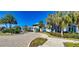 Community clubhouse with palm trees and paved road at 2204 Antilles Club Dr, Kissimmee, FL 34747