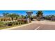 Gated community entrance with palm trees and landscaping at 2204 Antilles Club Dr, Kissimmee, FL 34747