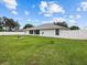 Large backyard with grassy lawn and privacy fence at 7438 Floral W Cir, Lakeland, FL 33810