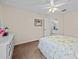 Cozy bedroom with a full-size bed and access to a bathroom at 7438 Floral W Cir, Lakeland, FL 33810