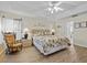 Large bedroom with king-size bed and access to bathroom at 7438 Floral W Cir, Lakeland, FL 33810