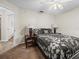 Bedroom with double bed, nightstands, and ceiling fan at 7438 Floral W Cir, Lakeland, FL 33810