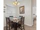 Cozy dining area with four chairs and a decorative tablecloth at 7438 Floral W Cir, Lakeland, FL 33810