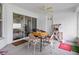 Relaxing screened porch with seating and ceiling fan at 7438 Floral W Cir, Lakeland, FL 33810