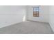 Simple bedroom with grey carpet and a window at 10064 Silver Laurel Way, Orlando, FL 32832