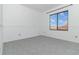 Bright bedroom featuring grey carpet and a window at 10064 Silver Laurel Way, Orlando, FL 32832