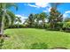 Expansive lawn featuring lush green grass, with trees and landscaping at 16161 Parkwyn St, Winter Garden, FL 34787