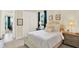 Cozy bedroom featuring natural light, a comfortable bed, and calming decor at 16161 Parkwyn St, Winter Garden, FL 34787