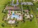 Aerial view of a community pool featuring a bar, ample seating, meticulously trimmed landscaping, and parking at 16161 Parkwyn St, Winter Garden, FL 34787