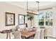 Bright dining room with a modern chandelier and natural light at 16161 Parkwyn St, Winter Garden, FL 34787