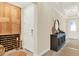 Hallway featuring a custom wine storage cabinet and console table at 16161 Parkwyn St, Winter Garden, FL 34787