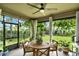 Outdoor patio with a dining table and view to yard with trees at 16161 Parkwyn St, Winter Garden, FL 34787