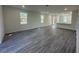 Large living area with bright windows, recessed lights, and luxury vinyl flooring at 4445 America St, Orlando, FL 32811