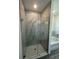 Modern shower with glass enclosure and hexagon tile floor at 4445 America St, Orlando, FL 32811