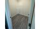 A view of the large walk-in closet with neutral paint and flooring at 4445 America St, Orlando, FL 32811