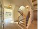 Bright foyer featuring hardwood floors, modern light fixtures, and an elegant staircase at 1730 Winchester Dr, Winter Park, FL 32789