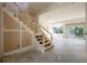 Unfinished staircase in home under construction with light streaming into the main living area at 1730 Winchester Dr, Winter Park, FL 32789