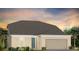 Single-story home with a two-car garage and neutral exterior at 1983 Spring Shower Cir, Kissimmee, FL 34744