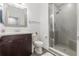 Bathroom featuring a dark wood vanity and glass enclosed shower at 2444 Lobelia Dr, Lake Mary, FL 32746